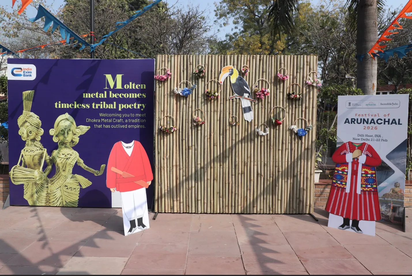 Branded backdrop with cutout signage at a state tourism flagship event