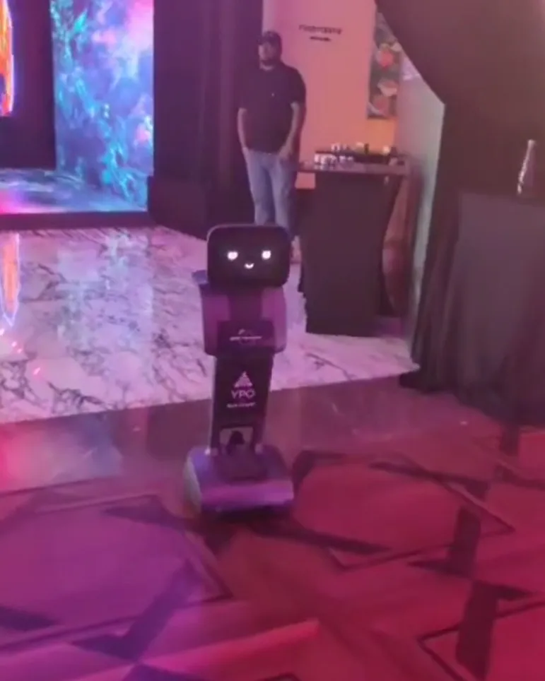 Mini-robot brand ambassador on the event floor at a corporate activation